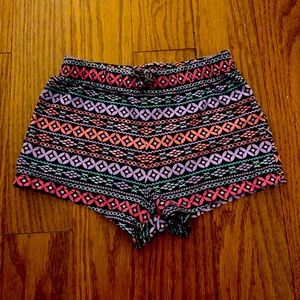 Navy Soft shorts with a pink, purple & teal pattern